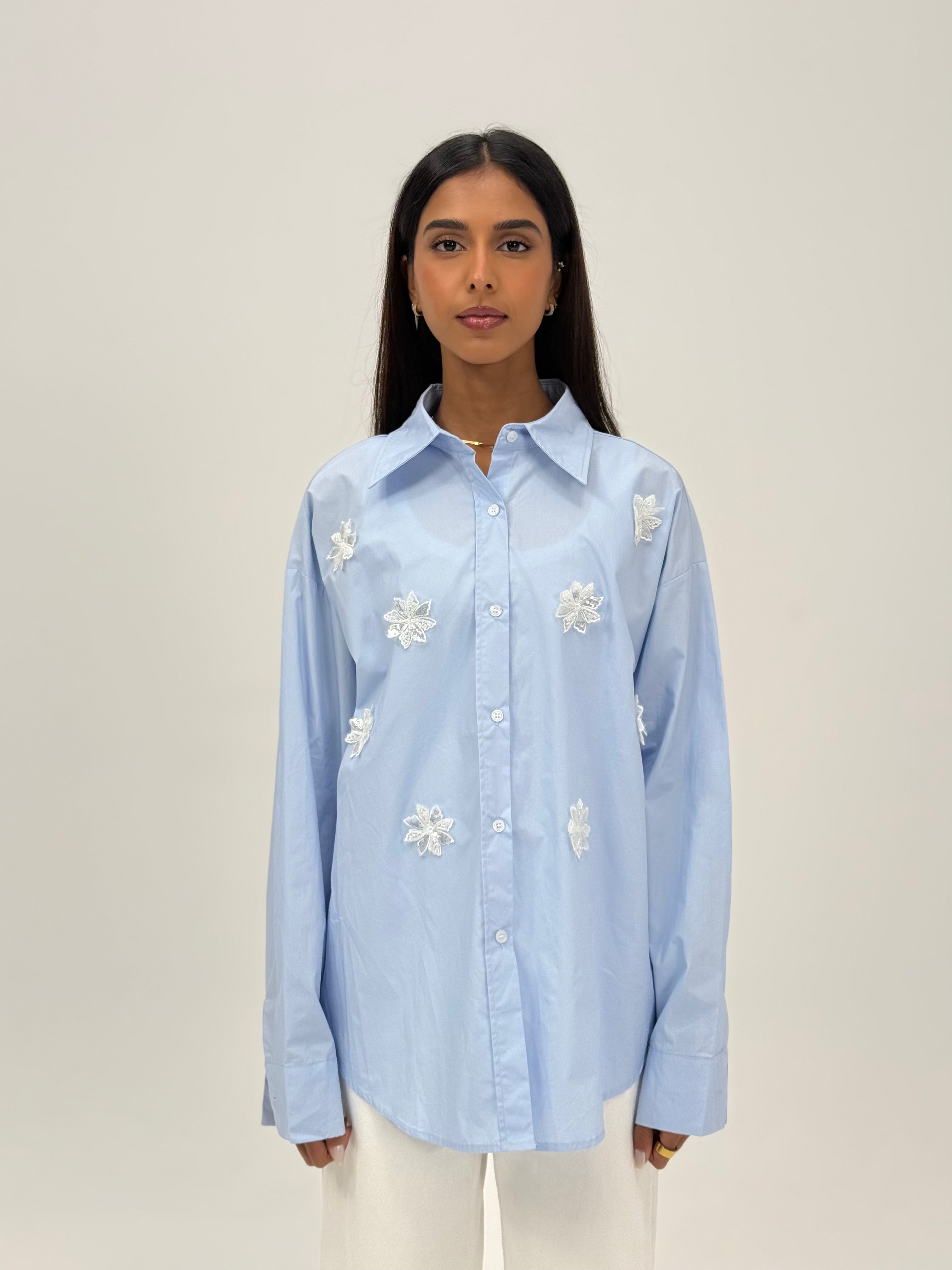 Shirt with beaded flower